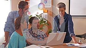 Creative business team using laptop computer