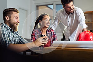 Creative business team working hard together in casual office