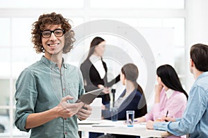 Creative businessman with tablet computer in