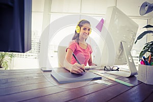 Creative businesswoman writing on a tablet