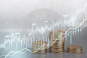 Creative candlestick forex chart on blurry golden coins background. Money, economy and finance concept. Double exposure