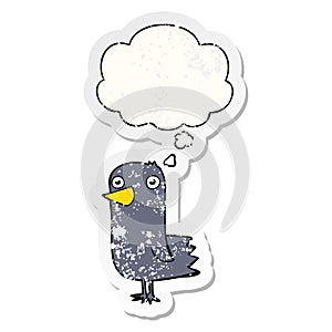 A creative cartoon bird and thought bubble as a distressed worn sticker
