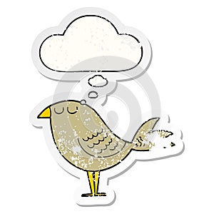 A creative cartoon bird and thought bubble as a distressed worn sticker
