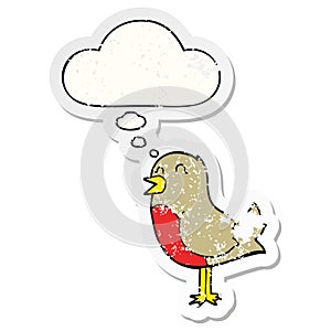 A creative cartoon bird and thought bubble as a distressed worn sticker