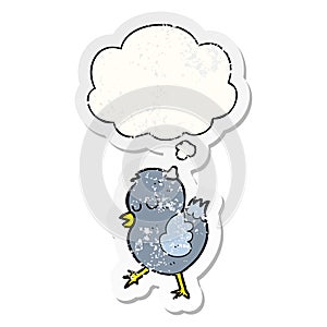 A creative cartoon bird and thought bubble as a distressed worn sticker