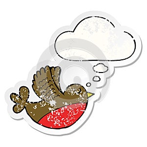 A creative cartoon flying bird and thought bubble as a distressed worn sticker