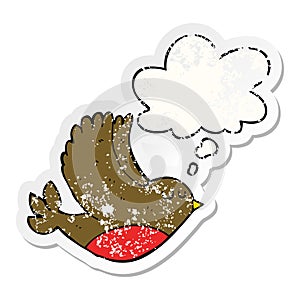 A creative cartoon flying bird and thought bubble as a distressed worn sticker