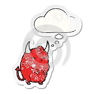 A creative cartoon halloween devil and thought bubble as a distressed worn sticker