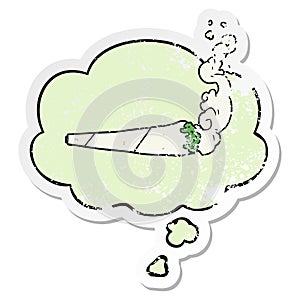 A creative cartoon marijuana joint and thought bubble as a distressed worn sticker
