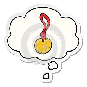 A creative cartoon sports medal and thought bubble as a printed sticker