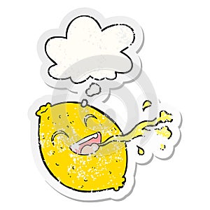 A creative cartoon squirting lemon and thought bubble as a distressed worn sticker