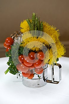 Creative centerpiece with vegetables and foliage