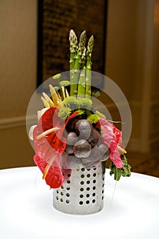 Creative centerpiece with vegetables and foliage