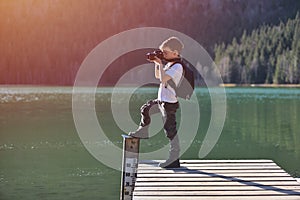 Creative child, kid photographer a little boy with a camera ta