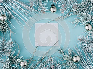 Creative christmas, New Year composition. Square blank frame with copy space, fir branches and cristmas decoration