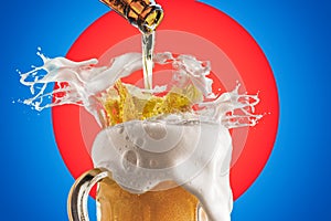 Creative Collage Of Beer Glass With Beer Splashes and Overflowing Foam on Bright Red and Vivid Blue Background