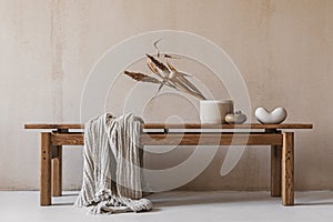Creative composition with elegant wooden bench. Beautiful decorations and accessories. Modern home interior design. Retro.