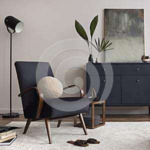 Creative composition of living room interior with mock up poster frame, velvet blue armchair, commode, decoration, lamp, side.
