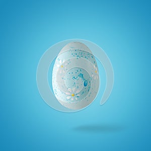Creative composition made of blue Easter egg. Minimal spring or summer Holiday concept. Fun background