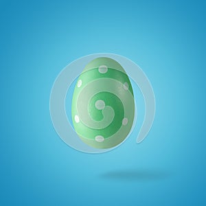Creative composition made of green Easter egg. Minimal spring or summer Holiday concept. Fun background