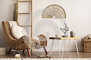 Creative composition of meditation living room interior with couch, beige carpet, pillows, ornament and personal accessories. Home