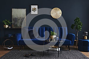 Creative composition of modern living room interior design with glamour blue sofa, metal shelf, coffee table and elegant home.