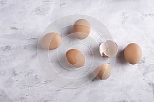 Creative concept, chicken eggs on a gray background close-up, top view. Organic Farmed Products.