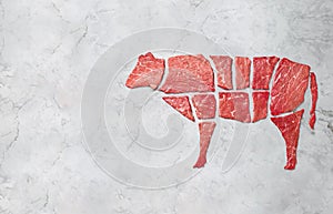 Creative concept marbled meat beef on white marbled background. Top view