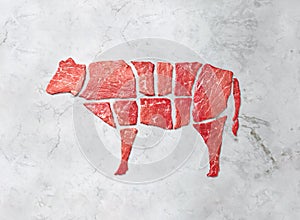 Creative concept marbled meat beef on white marbled background. Top view