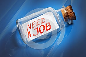 Creative concept of a message in a bottle saying Need a job