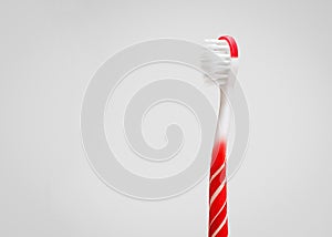Creative concept of oral hygiene. Toothbrush in the shape of a lollipop