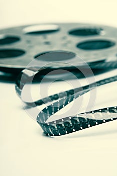 Creative concept of a retro movie film with a vintage film reel