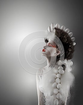 Creative Concept. Styled Futuristic Woman with Fantastic Headwear