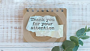 Creative concept Thank You For Your Attention text on notebook on wooden background