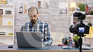 Creative content creator recording review of laptop