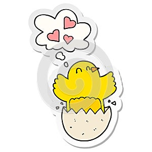 A creative cute hatching chick cartoon and thought bubble as a printed sticker