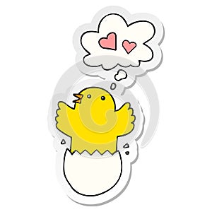 A creative cute hatching chick cartoon and thought bubble as a printed sticker