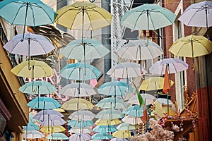 Creative decoration with colorful umbrellas along the way in the city of Athens near the Monastiraki district