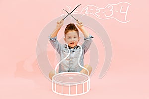 Creative design with drawn elements. Portrait of cute little boy, child dreaming to become musician and play drums
