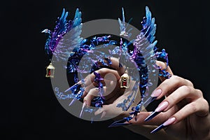 Creative design of nails on female hands. Art manicure.