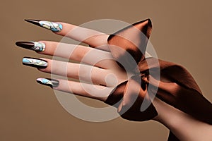 Creative design of nails on female hands. Art manicure.