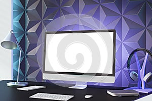 Creative designer desktop with empty white mock up computer screen, various items and decorative purple wall in the background. 3D