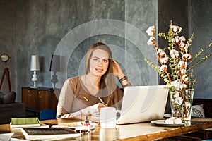Creative Designer Woman Using Laptop and Graphics Tablet at Office Deck