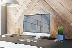 Creative desktop with blank black computer screen