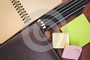 Creative desktop with empty notepad