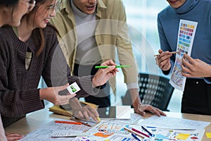 creative digital development agency brainstorming about mobile app interface wireframe design on desk at modern office