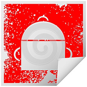 A creative distressed square peeling sticker symbol ruck sack
