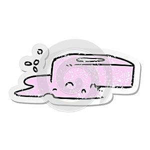 A creative distressed sticker cartoon doodle of a bubbled soap
