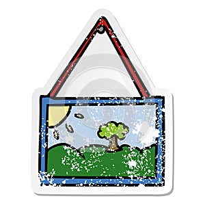 A creative distressed sticker cartoon doodle of a picture in frame