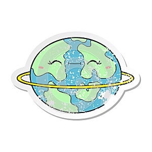 A creative distressed sticker of a cartoon habitable alien planet